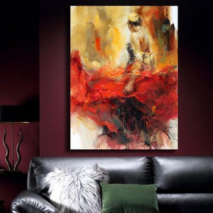 May include: An abstract oil painting of a woman in a flowing red dress. The artwork features a palette of red, yellow, and gold hues, with the figure's back turned, suggesting movement and grace. The painting is displayed on a wall above a black leather sofa.