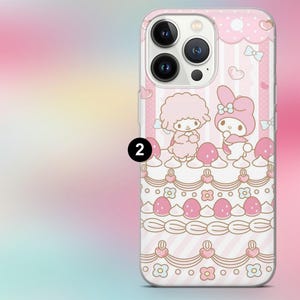 May include: Pink phone case featuring a cartoon design with two characters, bows, and hearts. The case has a layered design with pink and white stripes, strawberries, and floral accents. The number "2" is printed on the case.