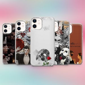 May include: A collection of phone cases featuring designs inspired by the musical "The Phantom of the Opera." The cases showcase various images, including the iconic mask, a rose, and scenes from the production. The cases are in a row.