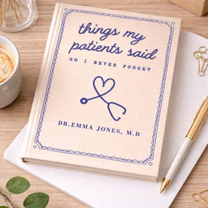 May include: A cream-colored journal titled "things my patients said" with blue text and a stethoscope graphic. The journal is open on a lined notepad, with a gold pen and paperclips nearby. A cup of coffee and decorative items are in the background.
