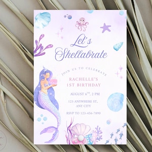 May include: A watercolor invitation with a mermaid theme. The invitation features a mermaid holding a cake, with text that reads "Let's Shellabrate" and details for a first birthday party. The color palette includes shades of purple, blue, and pink.
