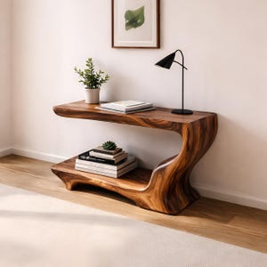 Może przedstawiać: Zestaw trzech ceramicznych kubków z nakrapianym, matowym wykończeniem. Kubki są w odcieniach kremu, jasnoszarym i ciemnoszarym. Każdy kubek ma prosty, minimalistyczny design, idealny do kawy lub herbaty.