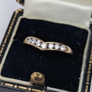 9ct gold wishbone with channel set cubic zirconia, size O