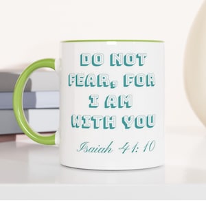 May include: A white ceramic mug with a bright lime green handle and interior rim. The front features the teal text DO NOT FEAR, FOR I AM WITH YOU followed by the scripture reference Isaiah 41:10 in a matching teal cursive script font.