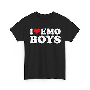 May include: A black short-sleeved t-shirt featuring the white text I EMO BOYS printed on the front. A red heart symbol replaces the letter O in the word LOVE, which is represented by the letter I and the heart icon in the top line of text.