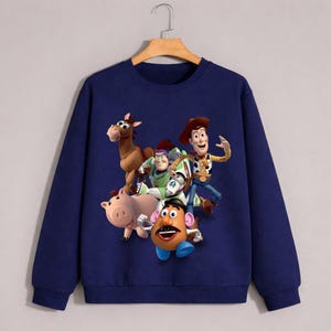 Felpa girocollo di Toy Story, con i personaggi Pixar Woody, Buzz e Hamm.