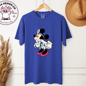 May include: A set of three ceramic mugs with a speckled, matte finish in shades of blue, green, and white. Each mug has a rounded shape and a simple, modern design, perfect for coffee or tea.