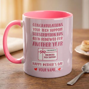 May include: A white ceramic mug with a black handle and the text "But First, Coffee" in a bold, black font. The mug is set against a blurred background, suggesting a cozy setting. The mug appears to be approximately 4 inches tall.