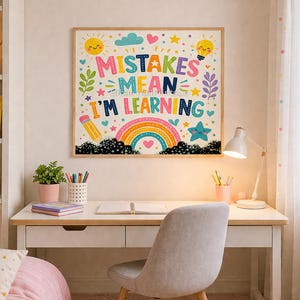 May include: A square wall art print featuring the colourful text MISTAKES MEAN I'M LEARNING. The design includes a yellow sun, a lightbulb, a pencil, a rainbow, and a blue star, all set against a white background within a light wood frame.