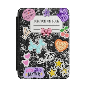 May include: Black composition book cover decorated with colorful stickers. Stickers include a purple butterfly, pink bow, cherries, and the text "You are enough don't forget that."