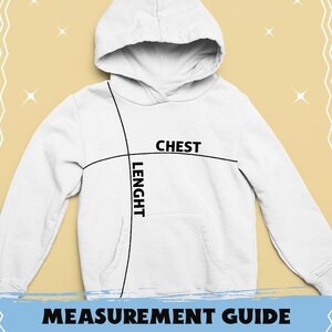 K&ouml;nnte beinhalten: Wei&szlig;er Kapuzenpullover mit dem Text "COMFORT COLORS 1567". Das Bild enth&auml;lt eine Ma&szlig;tabelle mit Brust- und L&auml;ngenma&szlig;en in Zentimetern. Der Pullover hat eine Brustweite von 53.3 cm f&uuml;r Gr&ouml;&szlig;e S und 74.9 cm f&uuml;r Gr&ouml;&szlig;e 3XL.