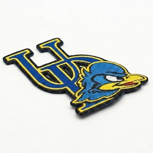 May include: A white ceramic mug with a black handle and the text "But first, coffee" in a handwritten style. The mug is likely 11-15 ounces and is suitable for hot beverages.