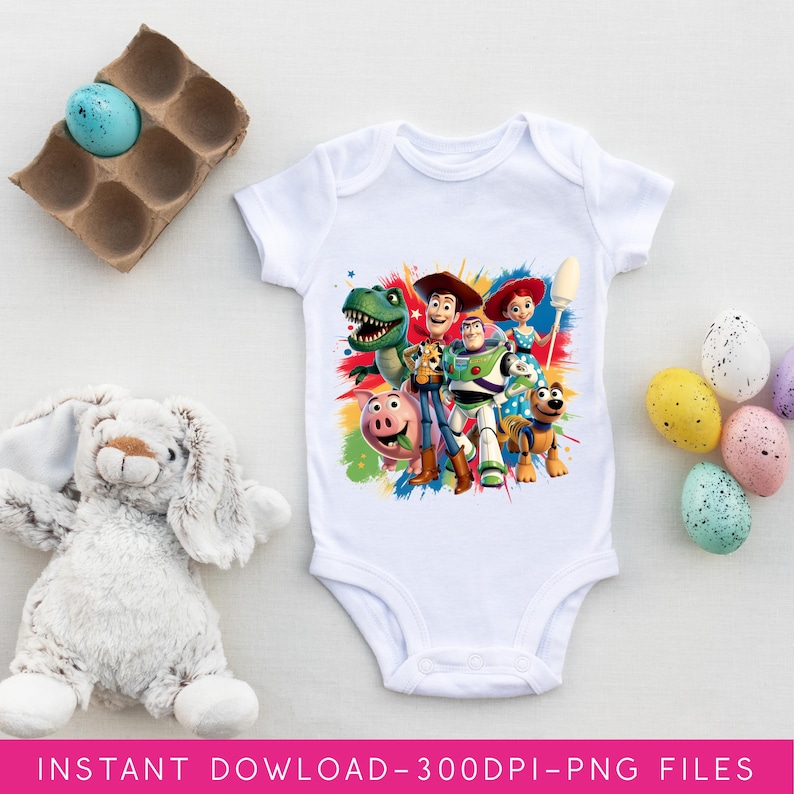 May include: White baby onesie featuring a colorful graphic of Toy Story characters. The design includes Woody, Buzz Lightyear, Rex, Jessie, and other characters. The onesie is surrounded by Easter eggs and a stuffed bunny.