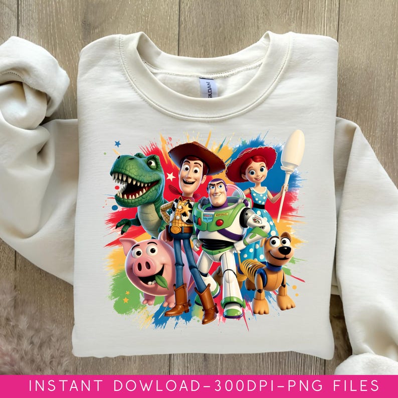 May include: A white sweatshirt featuring a colorful graphic of characters from the animated film Toy Story. The design includes Woody, Buzz Lightyear, Rex, Jessie, Hamm, and Slinky Dog. The text "INSTANT DOWNLOAD - 300DPI - PNG FILES" is at the bottom.