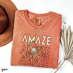 This Rocky inspired alien tee is made for readers who fell in love with one of the most unique friendships in modern science fiction. Whether you’re a dedicated Project Hail Mary fan or a general sci-fi nerd, this shirt is a fun conversation starter. Great for book clubs, science conventions, library events, or simply showing off your favorite space story.