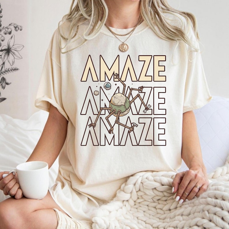 Celebrate your love for smart science fiction with this Comfort Colors® Project Hail Mary inspired shirt. Perfect for fans of space exploration stories, alien friendships, and clever problem solving. The design captures the iconic “Amaze” energy that readers instantly recognize. A must-have sci-fi reader gift for book lovers, space nerds, and anyone obsessed with unforgettable interstellar adventures.