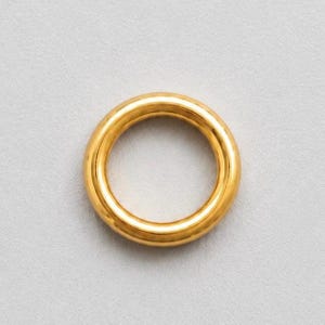 Kółko zaciskowe zamknięte wypełnione złotem 14k 5,5 mm (0,030) Opakowanie 50 sztuk