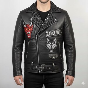 May include: Black leather jacket with a studded collar, zipper closure, and a belt at the waist. Features embroidered patches of a red devil, a wolf, and the text "REBEL HELL".
