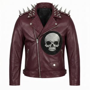 May include: A burgundy leather jacket with silver metal spikes on the shoulders and collar. The jacket features a silver skull patch on the chest and a zipper closure. The jacket has a classic biker style.
