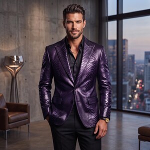 May include: A deep purple blazer with a textured snakeskin pattern, featuring a notched lapel, two front flap pockets, and a single button closure. The blazer is worn over a black button-down shirt with a thin gold chain necklace and a gold watch.