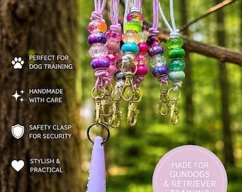 Cordino con fischietto per cani e moschettone di sicurezza a sgancio rapido.