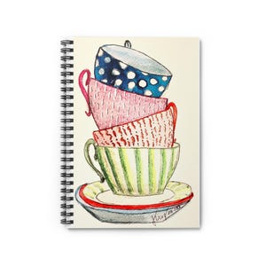 May include: Spiral-bound notebook featuring a watercolor illustration of stacked teacups. The teacups are in various colors and patterns, including blue polka dots, pink, red, and green stripes. A saucer with a red and blue rim is at the bottom.