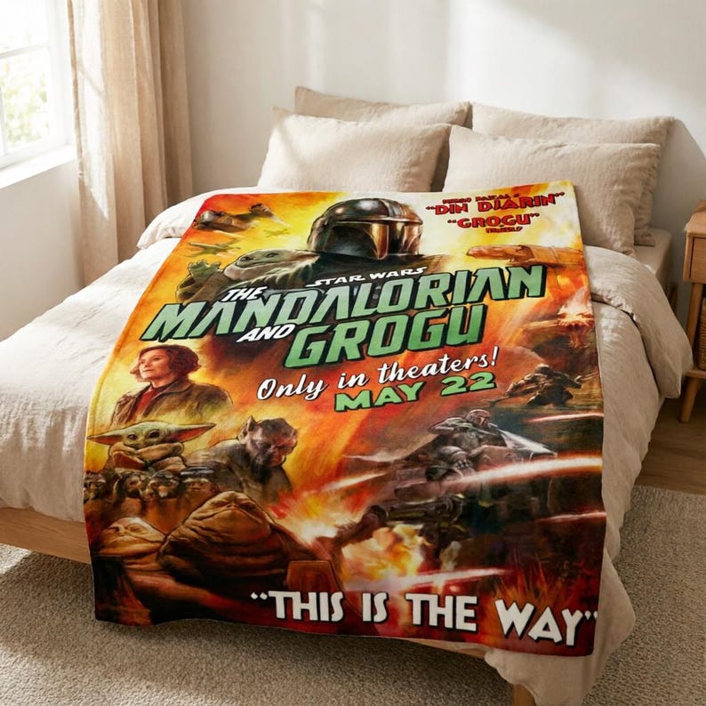 May include: A Star Wars themed blanket featuring the Mandalorian and Grogu. The blanket has a vibrant design with the text "The Mandalorian and Grogu" and "This is the Way". The release date "May 22" is also displayed.