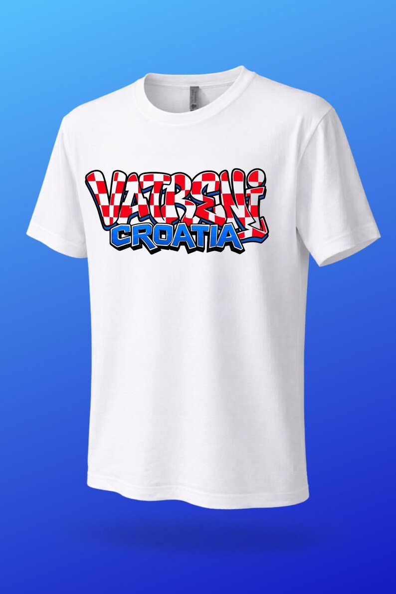 May include: White t-shirt with the text "VATRENI CROATIA" in a red, white, and blue design. The text is in a graffiti-style font. The shirt has short sleeves and a crew neck.