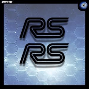 May include: Two black "RS" logos with a double-lined design are set against a hexagonal blue backdrop. The logos have a subtle shadow, giving a 3D appearance. The word "STORMSTICK" is in the top left corner.