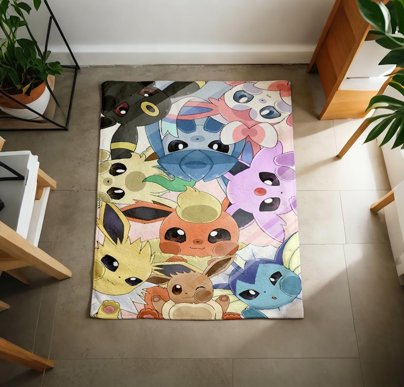 May include: A rectangular area rug featuring a colorful, detailed illustration of various Eevee evolution characters including Umbreon, Sylveon, Flareon, Jolteon, Vaporeon, and others, arranged in a dense, overlapping pattern with soft pastel tones.