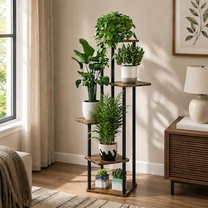 May include: A tall, multi-tiered plant stand featuring a black metal frame and dark wood-toned shelves. The stand holds five potted plants of varying sizes and foliage types, arranged on different levels to create a vertical display of greenery.