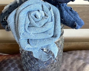 Eco friendly upcycled handmade blue denim Roses. Five about 6” tall roses in a small vase