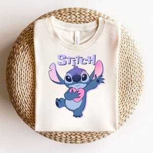 May include: A set of three ceramic mugs with a speckled, matte finish. The mugs are in shades of cream, light gray, and dark gray. Each mug has a simple, minimalist design, perfect for coffee or tea.