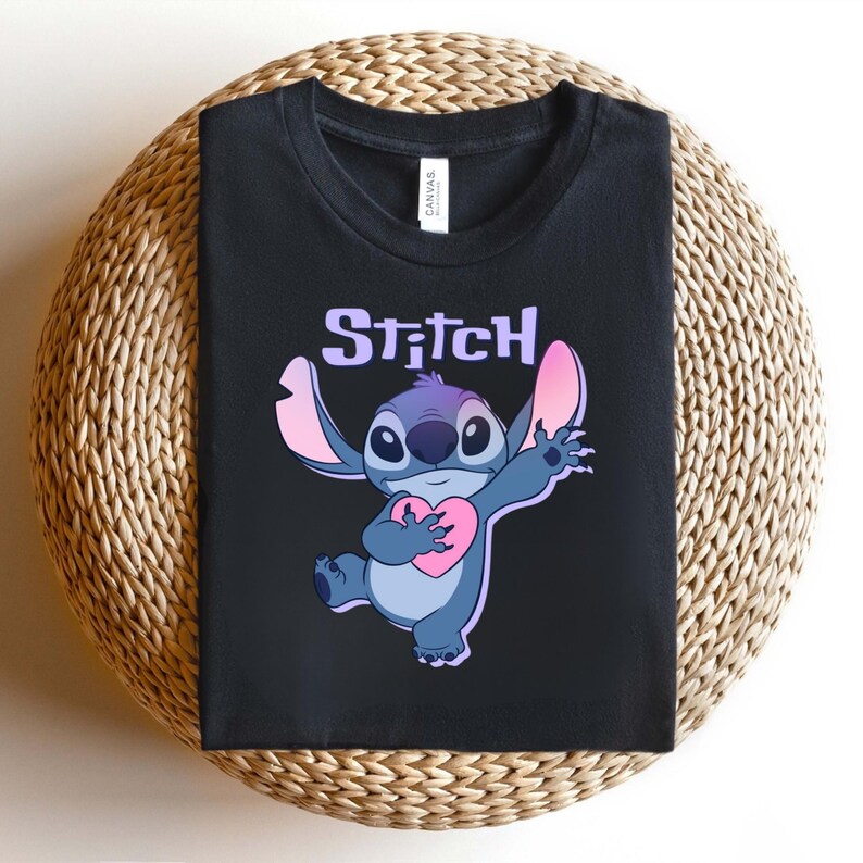 May include: A white ceramic mug with a black handle and the text "But First, Coffee" in a black, handwritten-style font. The mug is on a white surface.