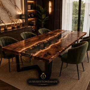 May include: A rectangular dining table featuring a live-edge dark wood slab with a central clear resin river inlay containing embedded stones, supported by a black metal frame, accompanied by six dark green upholstered chairs with metal legs.
