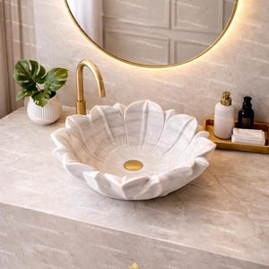 Premium white marble floral sink handcrafted with lotus design showcasing detailed carving smooth finish and natural veining ideal for luxury bathroom interiors contemporary spaces and designer decor enhancing aesthetic appeal