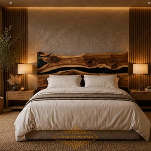 May include: A bedroom featuring a large wooden headboard with a black resin inlay. The bed is made with white linens and a neutral-toned comforter. Two wooden nightstands with lamps flank the bed. A decorative olive tree in a woven basket sits near the window.