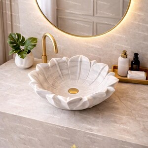 Modern luxury marble lotus sink made from natural white marble featuring floral sculptural design and refined polished surface perfect for statement bathroom decor upscale homes and high end interior design projects adding elegance and visual interest