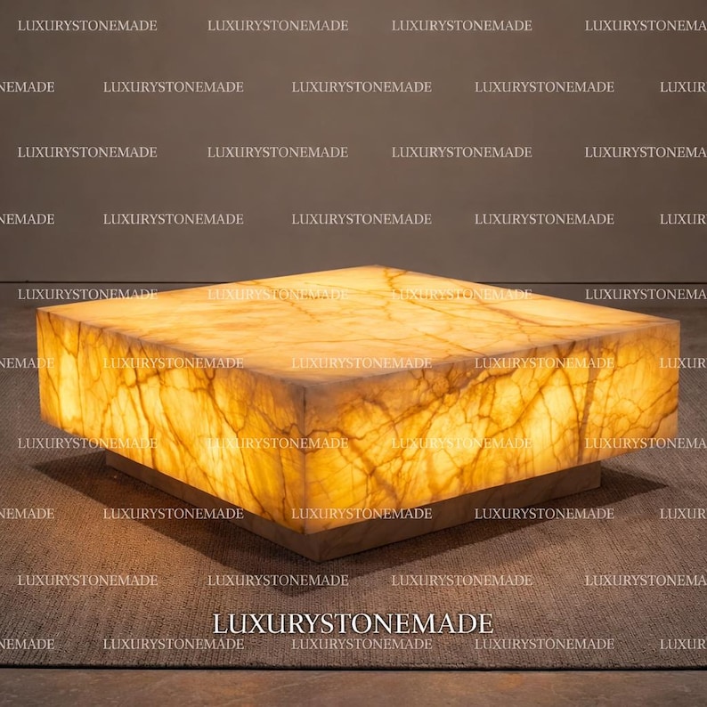 Backlit natural white onyx coffee table showcasing polished gemstone slab and glowing translucent mineral layers designed for luxury modern living rooms and upscale residential homes across the USA. Illuminated onyx stone surface forms striking centerpiece table enhancing contemporary architectural interior design.