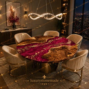 May include: A circular dining table with a burgundy and wood grain surface, gold detailing, and a gold base. Six beige upholstered chairs are around the table. The text "luxurystonemade" is at the bottom.