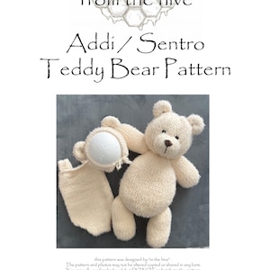 May include: A cream-coloured knitted teddy bear pattern with the text "Addi/Sentro Teddy Bear Pattern" and "from the hive". The pattern includes instructions for a teddy bear and a hat. The image also includes the text "Created with Addi 46 & 22 pin machine Copyright from the hive 2026".