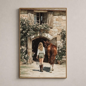 May include: A framed wall art print depicting a person with long blonde hair walking alongside a brown horse towards a stone building entrance. The scene features climbing roses on the stone wall, wooden shutters, and a rustic courtyard setting.