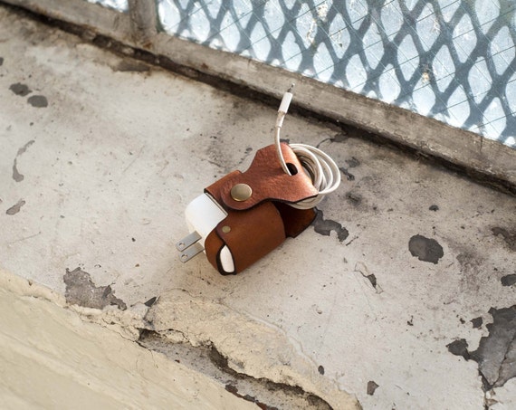 Hand-stitched Italian cowhide cord wrap that turns your janky cable situation into a leather goods flex.