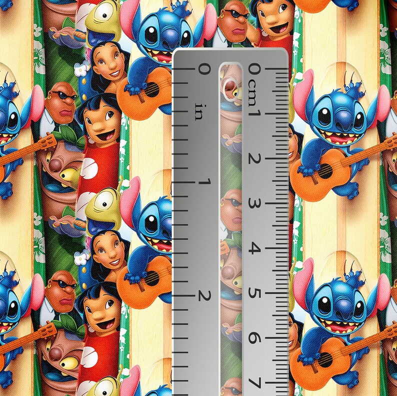 May include: Fabric featuring a repeating pattern of the character Stitch from the animated film "Lilo & Stitch." The design includes Stitch playing a guitar, along with other characters, set against a striped background. The ruler shows approximately 2 inches.