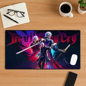 May include: A black rectangular mousepad featuring the title "Devil May Cry" in red and purple, with three characters wielding swords. A white mouse and a smartphone are also visible.