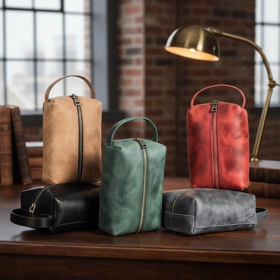 Rare crossover piece — doubles as a genuine leather Dopp kit AND a tech organizer, solving two packing problems in one handsome bag; the groomsman angle gives it real gifting narrative.