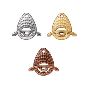 May include: Three metal charms in the shape of a teardrop with a hammered texture. The charms are silver, gold, and copper.