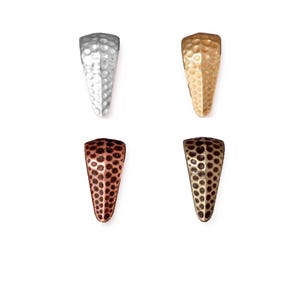 May include: Four metal cone-shaped jewelry findings in silver, gold, copper, and bronze. Each has a textured, hammered surface. The findings are displayed against a white background, showcasing their unique colors and finishes. These are ideal for jewelry making.