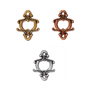 May include: Three ornate metal connector charms in gold, copper, and silver finishes. Each charm features a decorative, open-circle design with intricate details.