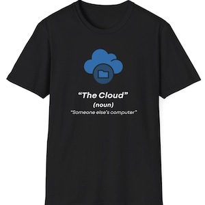 May include: Black t-shirt with a blue cloud and file folder graphic. The text below reads "The Cloud" (noun) and "Someone else's computer". A simple, everyday tee, perfect for casual wear.